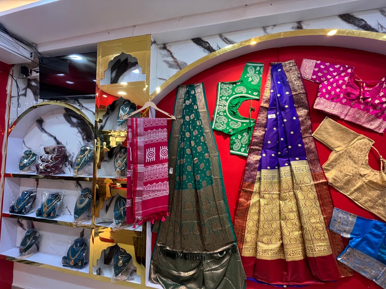 Bridal saree and jewellery display feature wall