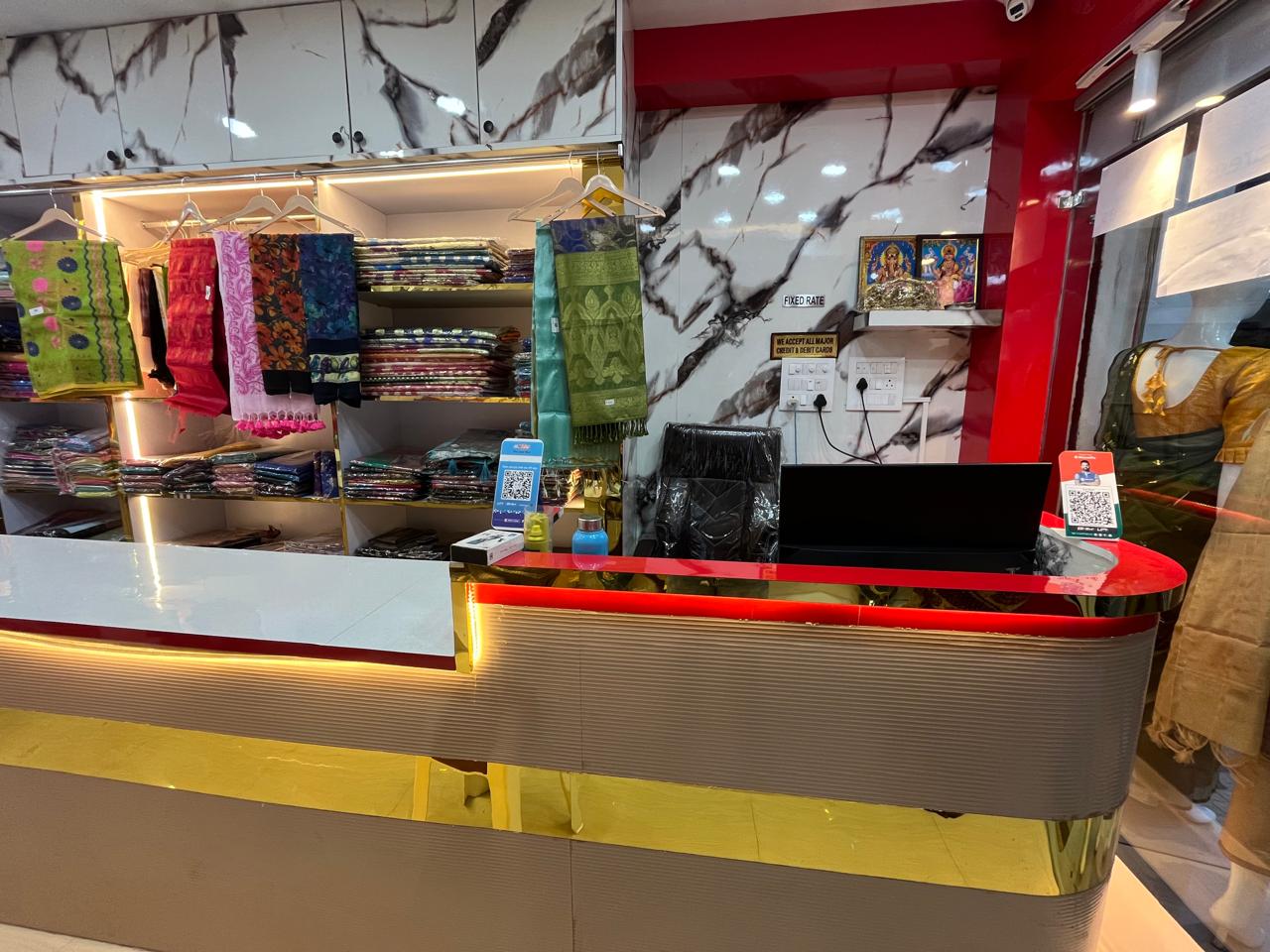 Boutique counter with saree wall display