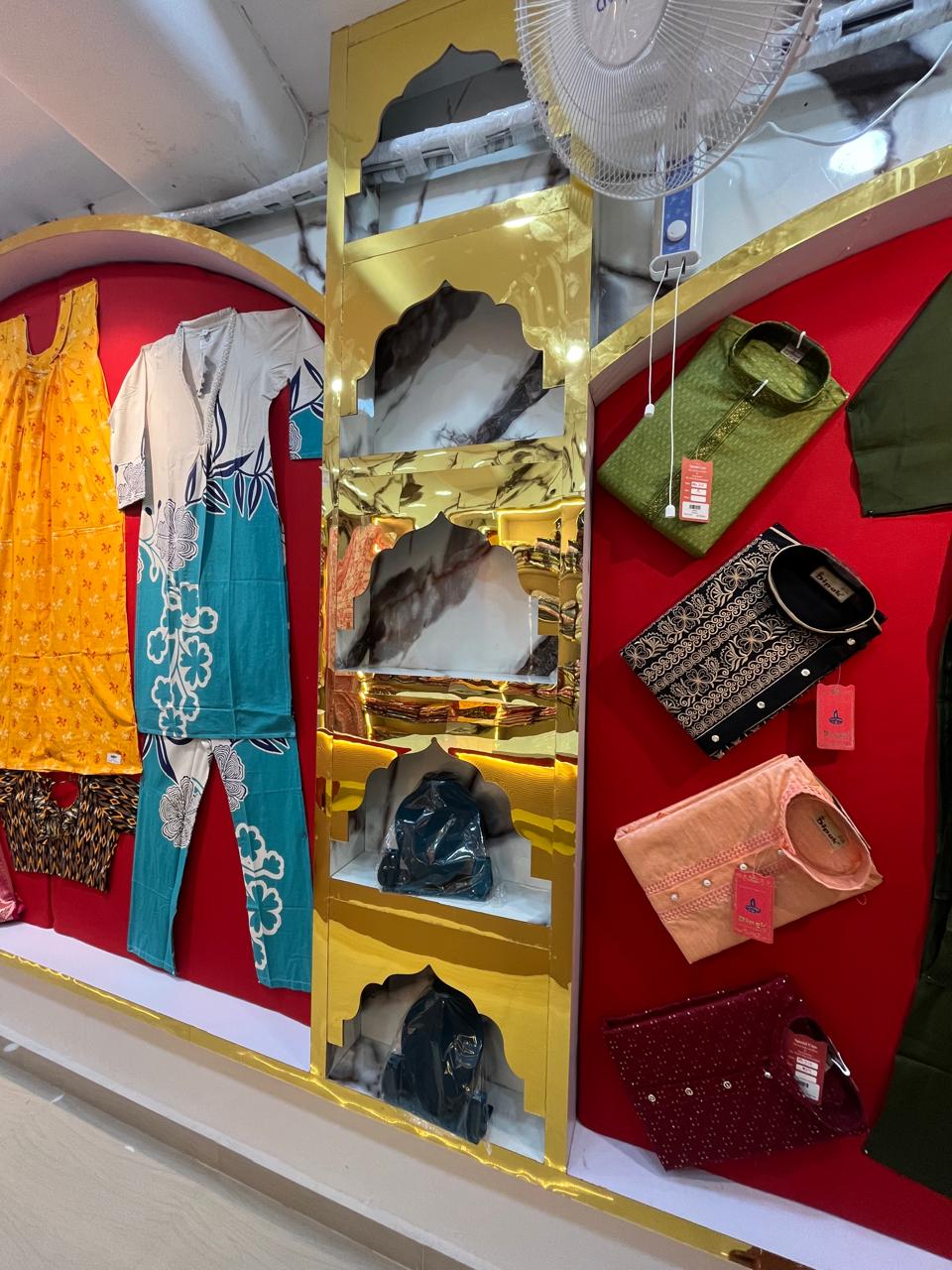 Arched retail wall with apparel display