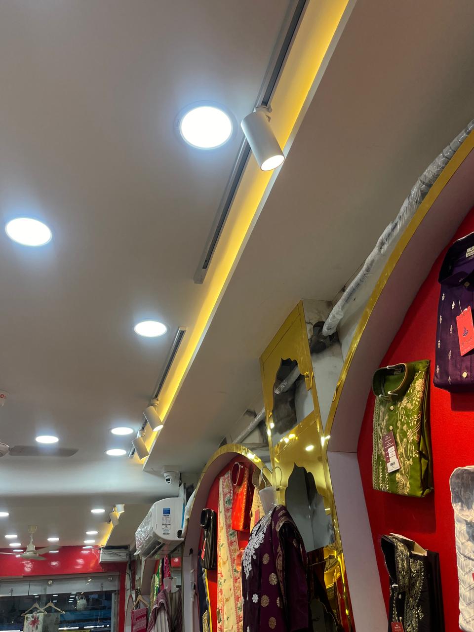 Boutique ceiling with track and recessed lighting